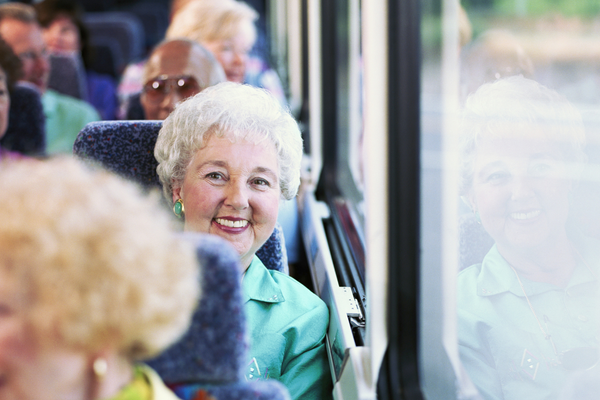 Woman on bus smiling